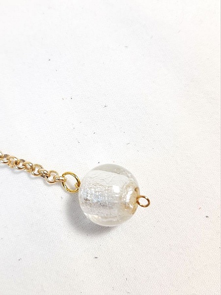 Bijou de sac pompon cuir de ch&egrave;vre coloris argent