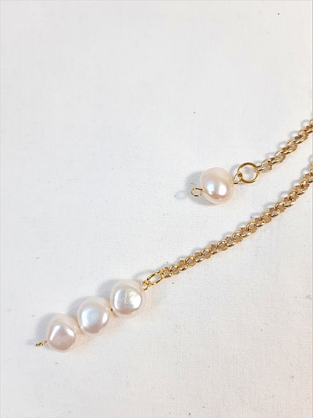 Bijou de sac pompon cuir de ch&egrave;vre coloris argent